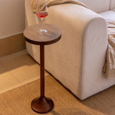 This unique minimalist drinking table has just the right amount of sleek modern style and eye-catching flair. The metal pedestal base features a textured finish with purposefully scratched distressing, topped by a flawless wood tabletop with a wood grain feature. Ready to be pulled up by any chair, this table will be the perfect place for you to enjoy a drink or open your favorite book. From your living room to your bedroom and all the spaces in between, this pedestal side table will be a great Drinking Table, Table Metal Base, Pedestal End Table, Pedestal Side Table, Small End Tables, Contemporary Side Tables, Swivel Barrel Chair, Wood Pedestal, Table Metal