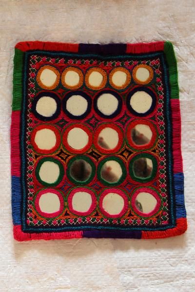 Mirror work embroidered with colorful thread which is worn by the female Lambani’s. Lambani Embroidery, Mirror Work Embroidery, Mughal Emperor, Indian States, Navratri Collection, Embroidery Mirror, Kutch Work Designs, Navratri Dress, Color Mirror