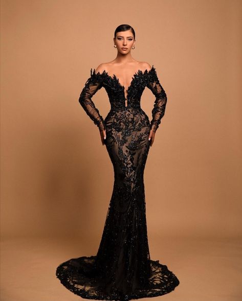 Fully embroidered black mermaid dress with deep v-neckline, off-the-shoulder sheer long sleeves. Black Jeweled Dress, Prom Dress Inspiration Long Sleeve, Black Met Gala Dress, Black Gown Photoshoot, Black Gala Dress, Md Dresses, Black Mermaid Dress, Black Mermaid Prom Dress, Matric Dance Dresses