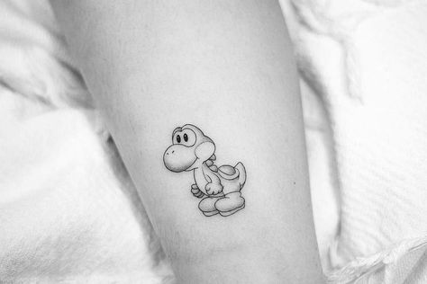 Small Yoshi Tattoo, Yoshi Outline, Yoshi Tattoo Black And White, Playstation Tattoo, Super Mario Tattoo, Groot Tattoo, Nintendo Tattoo, Video Game Tattoos, Mario Tattoo