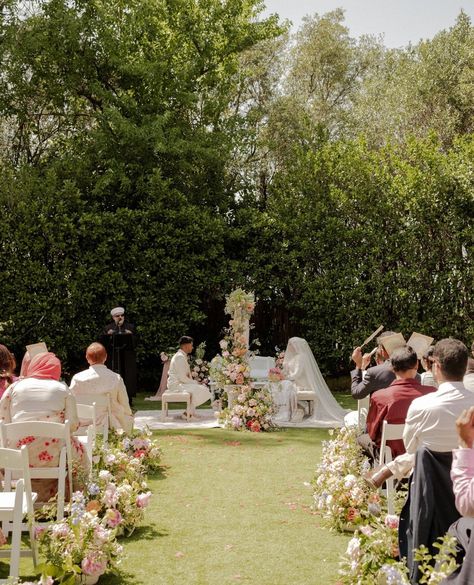 The most dreamy garden ceremony setup⁠ ⁠ One thing I love about these pictures is that you can see Samiha and Sohail's family and friends sitting and soaking in every moment in an unplugged ceremony⁠ ⁠ Photography: @ngcreativestudio⁠ Venue: @burnhamgroveestate⁠ Decor: @nokshaevents⁠ Bouquet: @springfull_⁠ Makeup: @mariamzafarbridal⁠ Bridal Outfit: @abhishekh_n_radhika⁠ Wedding Rings: @austenandblake⁠ Bridal Jewellery: @sgjewelz⁠ Nikkah Certificate: @calligraphybyaiman⁠ Garden Wedding Decorations Ceremony, Nikkah Ideas Pakistani, Nikkah Arrangement, Outside Nikkah, Nikkah Flowers, Nikah Ceremony Decor, Outdoor Nikkah Decor, Garden Nikkah, Nikah Setup