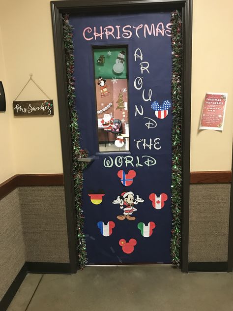 Disney Christmas around the world. Was only able to put a couple of flags. Not completed yet. Phase 1 Disney Holiday Door Decorations, Christmas Disney Door Decorations, Disney Christmas Door, Holiday Around The World, Mickey Classroom, Door Decoration Ideas, Christmas Doors, Christmas Door Decorating Contest, Disney Classroom