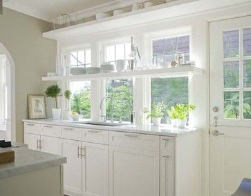 Similar to the other one - look at the shelf in front of the windows!! Would like it in the layout of the dark ones I just pinned. All from http://emilyaclark.com/2011/05/another-kitchen-idea.html. Luxury White Kitchen, Galley Kitchens, Amazing Kitchen, Kitchen Cabinets Decor, This Old House, White Kitchen Design, Kitchen Farmhouse, Kitchen Tops, Apartment Kitchen