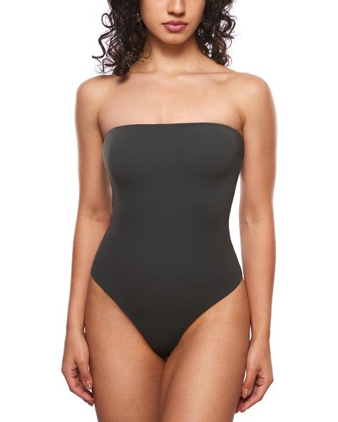 PRICES MAY VARY. Natrelax Collection - Crafted from soft and elastic fabrics, offering a second-skin feel and a smoothing effect, ensuring ultimate comfort Non-Slip strapless design provides a tight fit without slipping Double-layer fabric for not see-through and supportive fit. You can wear it even without a bra 4-way stretch fabric and bodycon design create a figure-hugging fit Thong-cut bottom for seamless wear, snap closures for easy on/off Perfect casual bodysuit for everyday wear, going ou Sleek Stretch High Cut Swimwear, Sleek Stretch High-cut Swimwear, Sleek High Cut Stretch Swimwear, Solid High Cut Swimwear With Boning, Solid Color High Cut Swimwear With Boning, Solid High-cut Swimwear With Boning, Solid High-cut Smoothing Swimwear, Stretch Bandeau Bodysuit For Beach, High Cut Shapewear Swimwear For Swimming