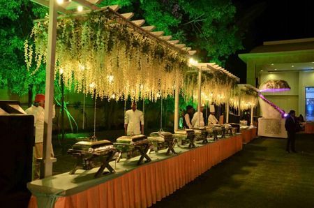 Floral Decor - Hallmark Bliss Weddings Pictures | Wedding Decorators in Lucknow - WedMeGood Wedding Food Stall Decoration, Wedding Food Counter Design, Traditional Buffet Table, Food Stall Wedding Decoration, Food Stall Decoration Ideas For Wedding, Food Counters Indian Wedding, Food Counter Design Wedding, Wedding Counter Decorations, Wedding Food Stations Indian