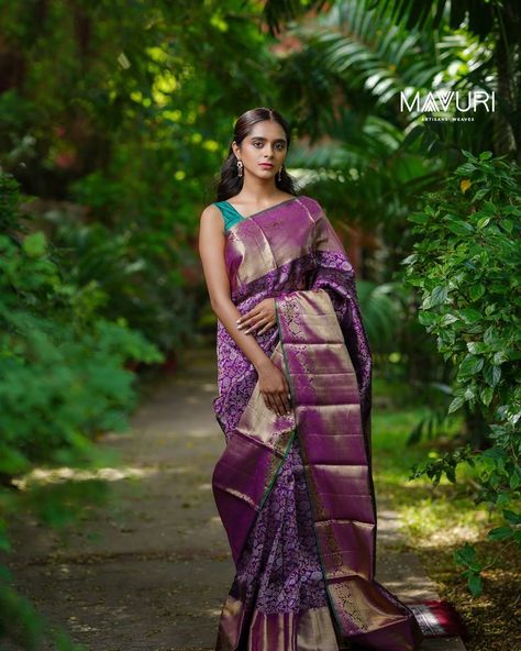 She hides in memories of vivid smiles
She merrily lies among violet charms.
The regal confluence of gold and silver zari, over a violet Kanchipuram silk sari, is the true definition of royalty. This exquisite sari with floral vines is a perfect choice for your wedding trousseau.
#kanchipuram #kanchi #kanchipattu #pattusaree #traditional #handloom #kanchipuramsaree #handloomsarees #kanchipuramsareedesigns #silk #silksaree #mavuriwoman #mavuri #mavurisilks #mavuriexperience #mavurieveryday Violet Kanchipuram Saree, Saree Outfit, Wedding Trousseau, Kanchipuram Silk Saree, Wedding Saree, Kanchipuram Saree, Silk Sari, Floral Vine, Handloom Saree