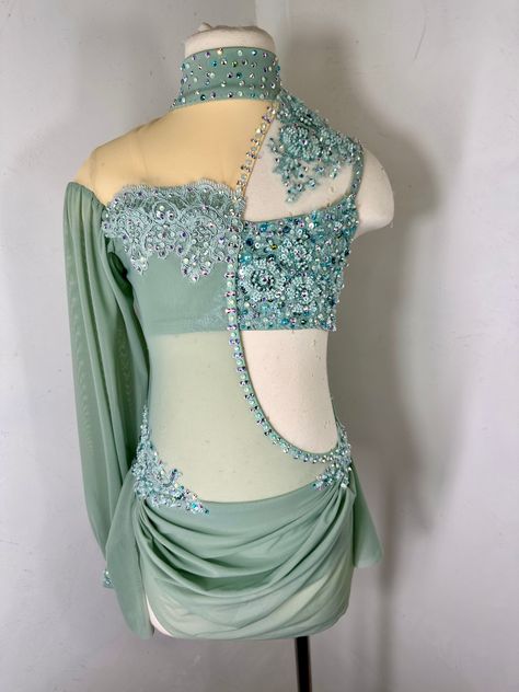 Sage green beaded applique dance costume with preciosa or swarovski crystal ab rhinestones Ready to ship in size Small Adult In production in size LC and one more size… can be made then the fabrics/ materials have been discontinued im sage but then could be ordered in another color.. with your measurements ready to ship in size SA or can be custom ordered in another color size with your measurements Please be sure to add your measurements and date needed by and any other adjustments or notes to the notes section of your order at checkout Green Dance Costume, Solo Dance Costumes, Pretty Dance Costumes, Custom Dance Costumes, Dance Competition Costumes, Dance Costumes Lyrical, Solo Costume, Competition Costumes, Custom Costumes