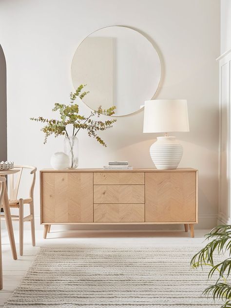 The perfect sideboard for a neutral or Scandi inspired interior, our stylish blonde oak piece features four slender, tapered legs and a subtle chevron finish.  Each piece has three handy drawers for ample storage, and pairs beautifully with other pieces from our Chevron Oak Furniture Collection.  Try styling your sideboard beneath a classic round mirror . Scandi Sideboard, Uk Living Room, Danish Living Room, Sideboard Styling, Light Oak Furniture, Scandi Living Room, Sideboard Styles, Chevron Furniture, Scandi Living