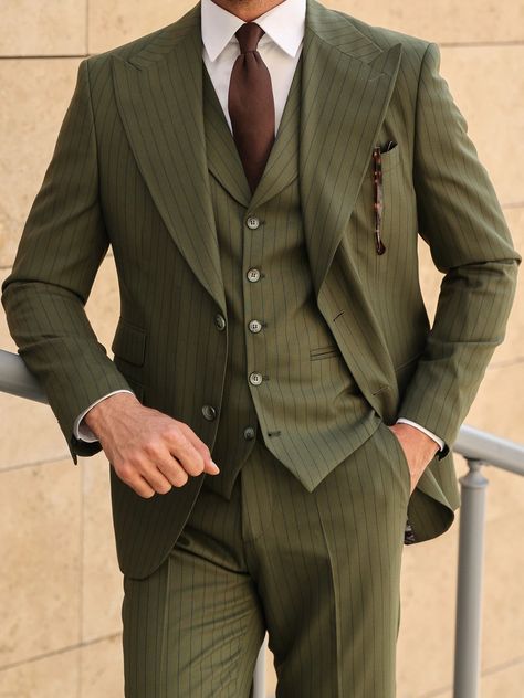 Shine in the spotlight with this magnificent khaki slim-fit 3-piece suit, featuring a sleek ticket pocket on the jacket and grand peak lapels on both the jacket and vest, exhibiting timeless elegance and historical prestige. Color: khaki striped Material: 70% wool, 27% polyester, 3% elastane Suit includes blazer, waistcoat, & trousers Single-breasted suit (2-button blazer) Lapel type: peak lapels Jacket interior lining option: fully-lined Jacket vent: double vent Fitting: slim-fit Care instructi Brown Suit Wedding, Blazer Waistcoat, Prom Men, Suit Stores, Slim Fit Suit Men, Formal Men, Slim Fit Tuxedo, Lapel Jacket, Green Suit