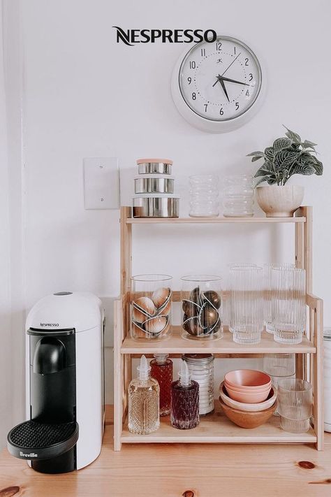 Explore 5 home decor ideas for organizing your coffee bar with shelves.  1. Open shelves: Use vertical space to show off your  coffee accessories.  2. Freestanding shelves: A good DIY storage option, even when counter space is limited.   3. Hidden shelves: This WFH coffee bar hides behind closet doors when not in use.  4. Cabinet shelves: Store often-used accessories above your Nespresso machine.  5. Lower shelves: Under-cabinet shelves offer space to stash extra sleeves, frothers and more. Coffee Bar With Shelves, Home Bar Shelving Ideas, Bar Storage Ideas, Bar With Shelves, Coffee Station Ideas Countertop, Coffee Bar Storage, Freestanding Shelves, Hidden Shelves, Coffee Bar Ideas Kitchen Counter