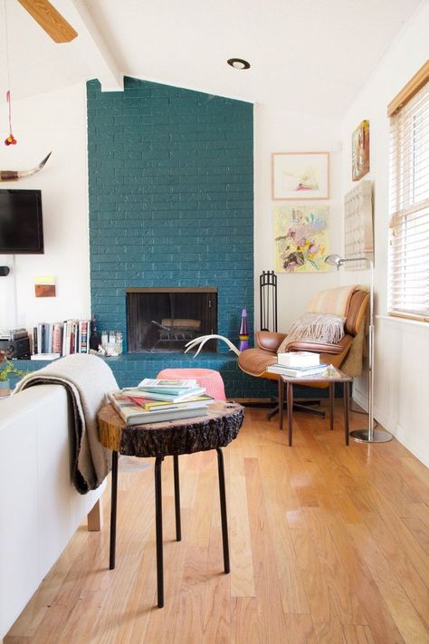 now i just need to steal the old tree trunk pieces from my neighbor's yard and i can make a sweet side table. Teal accent wall #turquoise #teal Painted Brick Walls, Painted Brick Fireplace, Painted Brick Fireplaces, Smart Tiles, Austin Homes, Modern Farmhouse Living Room, Fireplace Makeover, Painted Brick, Brick Fireplace