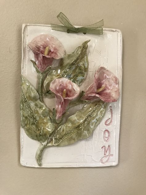 ‘Joy’ ceramic tile with callas Relief Tiles Ceramics Ideas, Botanical Ceramics, Flower Wall Art Ceramic, Relief Tiles Ceramics, Ceramic 3d Flowers, Ceramic Relief Tiles, Ceramic Tile Art Flowers, Ceramic Lily Flower, 3d Clay Mural Art Lotus