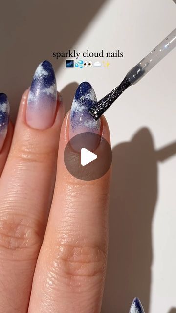 Paula 💅🏻🌙💗 on Instagram: "sparkly blue cloud nails! 🌃💦☁️✨
i love painting clouds with regular nail polish so much! they are super easy to paint and the q-tip method from @basecoatstories works perfectly! <3
— using:
• @kiaraskynails 
navy blue nail polish “Wine down” (my fav blue shade ever!)
white nail polish “Pure white”
silver glitter polish “Masterpiece”
(code PAULAR10 for 10% off! 💸)
#cloudnails #ombrenails #prettynails #nailpolish #nailart #nailarttutorial #nailinspo #naildesign #diynails #easynails #kiarasky #kiaraskynails #reels" Navy Blue And White Nails Design, Blue Cloud Nails, Navy Nail Art, Navy Blue Nail Polish, Cloud Nails, Blue And Silver Nails, Painting Clouds, Blue And White Nails, Navy Nails