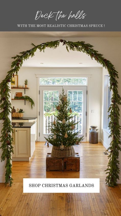 christmas arch garland decor with norway christmas tree Door Arch Garland Christmas, Arch Mirror Christmas Decor, How To Decorate Arches In House, Arch Christmas Decorations Entryway, Christmas Decorations Archway, Arch Way Christmas Decorations, Garland In Archway Christmas, Archway Garland Christmas, Decorate Archway In Home