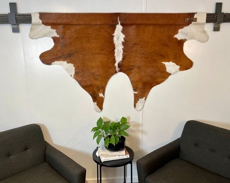 ALeatherHangs - Etsy Hang Cowhide On Wall, Cowhide Wall Decor Ideas, Goat Hide Decor, Deer Hide Wall Hanging, Hanging Cowhide On Wall, Cowhide Rug On Wall, Cow Hide Wall Decor Ideas, Cowhide Wall Decor, Cowhide On Wall Ideas