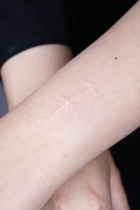 35 Hot Small Star Tattoo Design Ideas North Star Tattoo White Ink, White Sparkle Tattoo, Northern Star Drawing, White Ink Star Tattoo, White Ear Tattoo, Polar Star Tattoo, 8 Pointed Star Tattoo, Star Tattoos On Chest, White Tattoos For Women