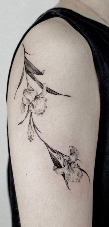 Iris Flower Tattoo Ankle, Iris Flower Fine Line Tattoo, Iris Vine Tattoo, Black And Grey Iris Tattoo, Iris Hip Tattoo, Artsy Flower Tattoos, White Iris Tattoo, Wild Iris Tattoo, Dainty Iris Tattoo