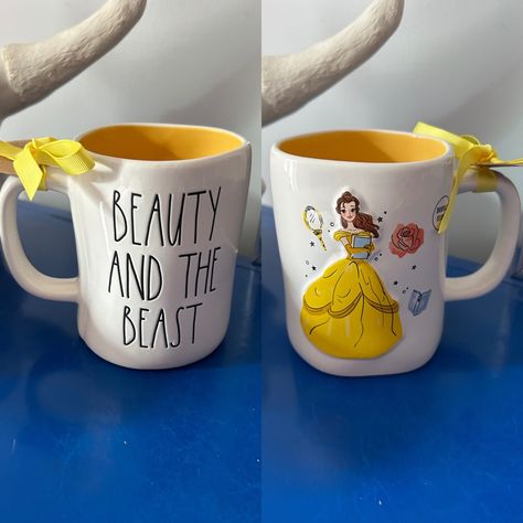 Rae Dunn Disney Beauty And The Beast Belle Double Sided Mug Rae Dunn Disney Beauty And The Beast Mug. White Mug With Yellow Inside And The Words Beauty And The Beast On One Side In The Signature Rae Dunn Font. The Other Side Has A Raised Picture Of The Beautiful Belle With Pictures Of A Mirror, Book And Rose. New With Tags! Dishwasher Safe. Rae Dunn Is Known To Be Perfectly Imperfect So There May Be Small Blemishes. Check Out My Other Listings For More Disney Rae Dunn Items! Rae Dunn Font, Rae Dunn Disney, Boss Lady Mug, Beauty And The Beast Belle, Wooden Cheese Board, Peppermint Mocha, Charlie Brown Peanuts, Disney Beauty And The Beast, Charlie Brown And Snoopy