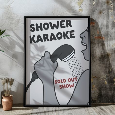 Bring fun and humour to your space with our Shower Karaoke print, capturing the joy of singing your heart out in the shower. This lively illustration showcases the playful spirit of Shower Karaoke, featuring a character passionately singing into a shower head. With bold text reading "Shower Karaoke" and a cheeky "Sold Out Show" tagline, this print is perfect for anyone who enjoys the simple pleasure of a private concert under the spray.  Ideal for brightening up a bathroom or adding a whimsical touch to any room, this artwork makes a fun gift for music lovers or a unique addition to your own decor, celebrating everyday moments with a smile. HOW TO ORDER: Select the Size from the drop down menu and we'll do the rest. PRINT DETAILS: -Size: Multiple sizes available - please see the image for