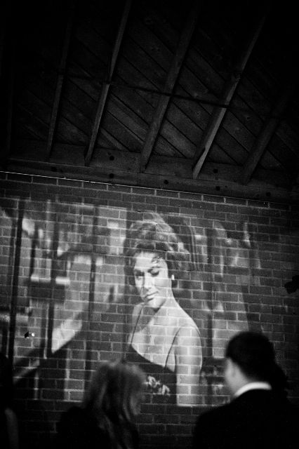 This inspired me - have a black and white film playing on the wall of the b and g talking about each other for those guests interested about "their story," etc. Black And White Movie Party, Projector On Wall, Wedding Projector, Black And White Themed Party, Old Hollywood Prom, Old Hollywood Party, Hollywood Prom, Film Projection, Old Hollywood Theme