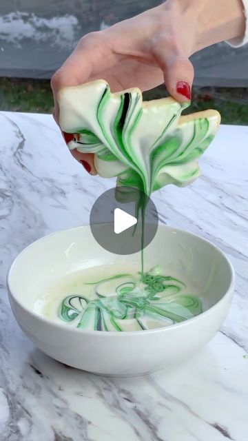 Sheri Wilson on Instagram: "Marbled Sugar Cookies 🍪🎄  This is my favorite way to decorate sugar cookies and the results are always beautiful! You can also make it with any colors you like and use multiple shades.  (Sugar Cookie and Icing recipe in my cookbook Caketopia)  Dip the end of a toothpick into food coloring and swirl it into a bowl of thinned royal icing.   Place your cookie face down into the icing then lift out slowly, allowing the excess to drip off. Allow the icing to harden before serving.  #cookies #sugarcookies #christmas #baking #easyrecipes #cookiedecorating #christmascookies #bake #holidaybaking #holidays #desserts #christmasbaking" Marble Royal Icing Cookies, Edible Markers On Cookies, Christmas Cookies Decorated Icing, Christmas Cookies With Royal Icing, Sugarcookies Christmas, Holidays Desserts, Marble Cookies, Swirl Sugar Cookies, Sheri Wilson