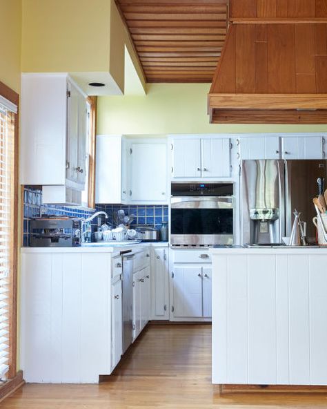 This Is What Happens When a Food Editor Decides to Renovate Her Kitchen:  (BEFORE): While the pre-renovation V-shaped working configuration was fine, a wall oven and large refrigerator ate up potential countertop space. The fake soffit above the cabinets made the ceilings appear low, which in turn made the space feel tight. Above The Cabinets, Kitchen Soffit, Large Refrigerator, Hells Kitchen, Cabinet Making, New And Improved, In Kitchen, Wall Oven, Living Food