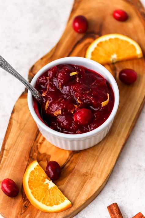 Zesty Cranberry Orange Sauce is easy to make homemade. Add cinnamon for a touch of spice and a whole lotta zest for a sweet, yet tart holiday sauce! Use the cranberry sauce on Thanksgiving or Christmas with your main meal and use leftover sauce as a jam on sandwiches or as a yogurt sweetener. #cranberrysauce #thanksgiving #christmass #withcinnamon #withorange Paleo Cranberry Sauce, Spicy Cranberry Sauce, Turkey Gravy Recipe Easy, Best Cranberry Sauce, Honey Butter Recipe, Turkey Gravy Recipe, Tangerine Juice, Cranberry Sauce Recipe, Cranberry Sauce Homemade