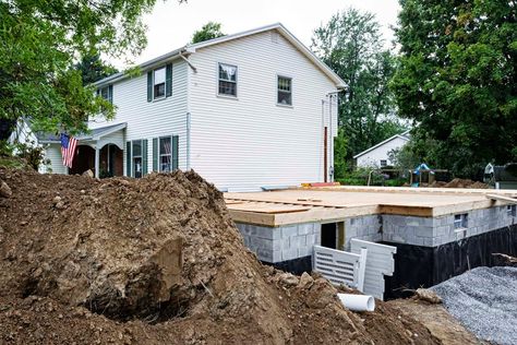 The cost to dig out a basement, whether for a new home, crawl space conversion, or full basement expansion, can yield an impressive return on investment. Waterproofing Basement Walls, Basement Addition, Building A Basement, Pool Water Features, Room Addition, Building Remodeling, Waterproofing Basement, Small Basements, One Home