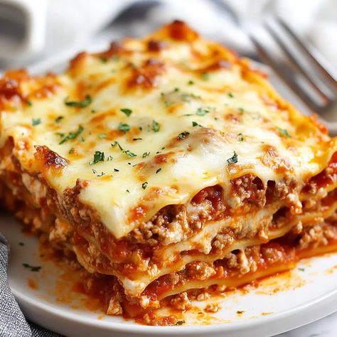 Easy Beef Lasagna Recipe - sandyrecipes.com Lasagna Recipe No Sausage, Easy Beef Lasagna Recipe, Lazana Recipes Lasagna Easy, Lazana Recipes, Spicy Lasagna Recipe, Lazania Recipe, Baked Lasagna Recipe, Ground Beef And Spinach, Beef Lasagna Recipe