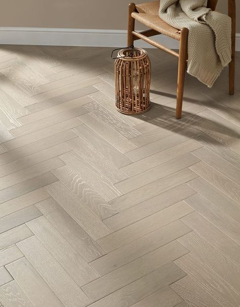 Tired of the same old boring flooring? This superb Oxford Herringbone Pearl Grey Oak is an affordable, yet highly specified engineered wood floor. With it charming natural wood markings and authentic wood knots, it will truly make a chic statement in your home. Consisting of seven coats of super lacquer, this wood floor will dazzle with its creamy beige hues and soft grey undertones. Its outstanding 3mm wear layer, will ensure your flooring lasts for years to come. Our Oxford Herringbone Pearl G Engineered Wood Floors Oak, Herringbone Floors, Herringbone Tile Floors, Direct Wood Flooring, Herringbone Wood Floor, Herringbone Wood, Engineered Wood Flooring, Herringbone Floor, Flooring Inspiration