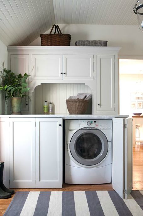 Sage Design - laundry/mud rooms - folding doors, folding cabinet doors, hidden washer and dryer, concealed washer and dryer, beadboard ceili... Rustic Farmhouse Laundry Room, Cottage Laundry Room, White Laundry Room, Queenslander Homes, Hidden Laundry, Ideas Baños, Laundry Room/mud Room, Mudroom Laundry Room, White Laundry