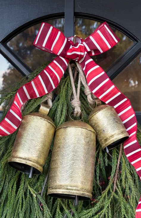 The perfect Christmas bells to hang on your front door! #bells #christmasdecor #christmasdecorating Cow Bell Decor, New England Christmas, Holiday Door Decorations, Diy Christmas Door, Christmas Door Decoration, Driven By Decor, Front Door Christmas Decorations, Bell Decorations, Christmas Front Doors