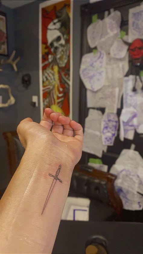 Matching Outline Tattoos, Small Dagger Tattoo Simple, Dagger Arm Tattoo, Small Arm Tattoo Placement, Cross Word Tattoo, Fine Line Dagger Tattoo, Cute Dagger Tattoo, Dagger Tattoo Placement, Crossed Swords Tattoo