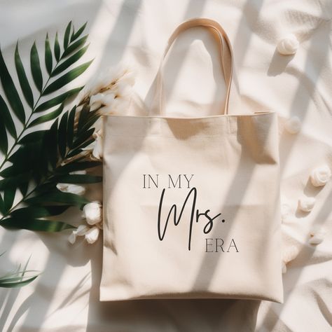 "In My Mrs Era Tote, Wedding Era, Bride Gift, Gift for Friend, Wedding Tote Bag, Canvas Tote Bag, Tote Bag, Bride Tote, Gift for New Bride -100% cotton canvas -20\" handles -Heavy fabric -Flat corners -Sewn-in label -Tumble dry: low heat -Do not iron directly over the printed area - print may stick to the iron -Do not wash No returns, cancellations, or refunds. These items are custom made and once an order is placed, they go straight into production. If there is an issue with your product, please contact me. **Shipping to Alaska and Hawaii can take additional 7 - 12 business days.**"