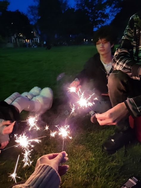 Friends sitting in circle holding sparklers Faceless Friend Pics, 3 People Aesthetic, Group Friendship Aesthetic Faceless, Friendgroup Aesthetic Faceless, Friends Grunge Aesthetic, Friendship Aesthetic Pictures, Opposite Best Friends Aesthetic, Imaginary Friend Aesthetic, Photoshoot Faceless