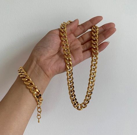 "18K Gold Filled Cuban Chain Necklace | Gold Filled Cuban Chain | Chunky Cuban Chain | Cuban Bracelet | Thick Cuban Necklace | Gold Cuban Choker 12 MM Material: 18K Gold Filled Closure: There secure nicely with a beautiful lobster clasps Cuban Necklace Length: 15\" Width: 12MM Cuban Bracelet: Length: 6\" +1\" Width: 12 MM WATERPROOF *Tarnish resistant *8 layers of 18K Gold Filling for the lasting shine *Comes in a velvet gift bag, ready as a gift Gorgeous, high-quality 18 karat gold filled Cuban Gold Cuban Link Chain, Cuban Link Chain Necklaces, Chunky Chain Necklaces, Necklace Chain Lengths, Chain Anklet, Cuban Chain, Metal Bracelets, Stainless Steel Necklace, Steel Jewelry