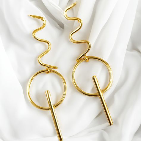 Fashion Habit Earrings: Innovative, multifunctional jewelry that goes beyond adornment, offering style and utility in one unique accessory. _________________________________________ Shop Now: folklorecollections.com _______________________________________ #JewelleryElegance #ButterflyBrassPearl #TimelessBeauty #Folklore #Folklorecollections #Worldoffolklore #newearrings #fashionearring #Newcollection #jewwellery #earring Folklore Earrings, Bohemian Adjustable Spiral Hoop Earrings, Festival Spiral Gold Earrings, Bohemian Spiral Earrings, Multifunctional Jewelry, Elegant Spiral Brass Hoop Earrings, Folklore Fashion, 2024 Fashion, Fashion Wear