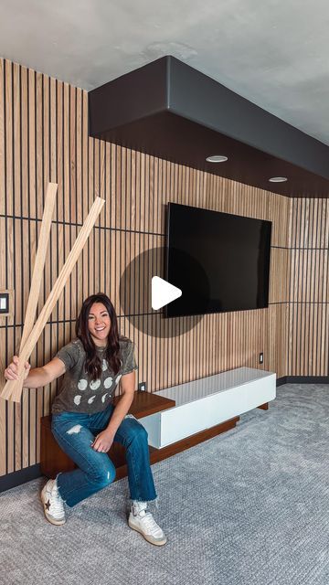 Mysha Bolen| DIY Interior Designer on Instagram: "To everyone thinking I could never do this… YOU TOTALLY CAN! … And I’ll show you how! I am so excited about how this modern media wall has come together. Have I succeeded in cooperating the ugly soffits into a cool design??? Vote below! Wood slats from @weaberlumber . . Comment ⭐️LINK⭐️ and I’ll dm you direct links to my tools used, supply list, wood slats, paint color, paintable outlets, and full tutorial! #weaberlumber #makeitweaber" Slat Wall Tv Ideas, Slat Wall Living Room, Modern Media Wall, Wood Slat Wall, Wall Borders, Wood Cladding, Acoustic Wall, Media Wall, Living Room Tv Wall