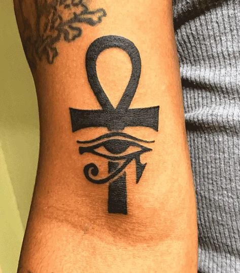 180 Excellent Ankh Tattoo Designs with Meanings (2022) - TattoosBoyGirl Ankh Eye Tattoo, Ankh Eye Of Horus Tattoo, Ankh Tattoo Women Chest, Eye Of Ra Tattoo Design, Key Of Life Tattoo, Ankh Tattoo Women, Ankh Tattoo Design, Eye Of Ra Tattoo, Powerful Tattoos