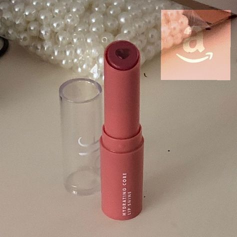 Elf Hydrating Core Lip Shine on Amazon. Different shades avaiable now. Elf Heart Core Lipstick, Elf Lipstick Heart, Elf Heart Lip Balm, Heart Makeup Products, Elf Makeup Products Aesthetic, Elf Lip Shine, Coquette Lip Gloss, Coquette Christmas List, Coquette Makeup Products