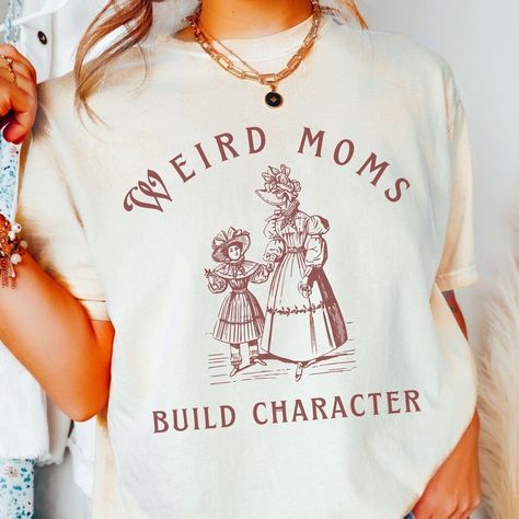 Mom Club Shirts, Weird Shirt Design, Weird Moms Build Character, Homeschool Shirts, Build Character, Mama Crewneck, Funny Mom Shirt, Designer Tshirt, Victorian Design