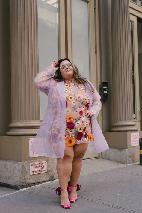 Plus size influencer and fashion blogger Natalie in the City wears a sheer floral dress and sheer lavender mesh trench coat with pink bow heels at New York Fashion Week. Plus size NYFW outfit inspo for spring 2023. Plus Size Lavender Outfits, Purple Graduation Outfit, Plus Size Blogger, Lover Era Outfits Plus Size, Spring Surrealism, Plus Size Garden Party Outfit, Plus Size Whimsical Style, Plus Size Maximalist, Plus Size Eras Tour Outfits