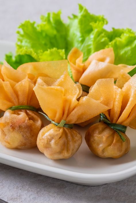 Thung Thong or Thai Money Bags are a delicious Thai snack or appetiser, part of the traditional Thai Royal Cuisine and often eaten at parties or served at special occasions such as Thai New year. This recipe is easy and perfect for prepping ahead of time, check out the new 1-click recipe! Thai Money, Thai Appetizer, Thai New Year, Thai Snacks, Thai Spices, Meals For Four, Money Bags, Thai Dessert, Sweet Chilli Sauce