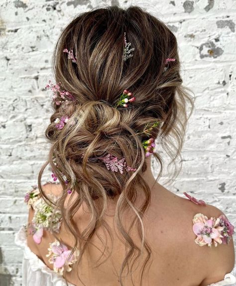 Wavy Bun with Flowers Fairy Princess Wedding Hair, Floral Updo Hairstyles, Enchanted Garden Hairstyle, Messy Bun With Flowers, Boho Wedding Hair Updo, Fairy Wedding Hair, Bohemian Updo Hairstyles, Updo With Flowers, Flower Updo