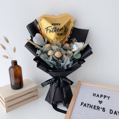 Genie Floral on Instagram: “💫FATHER’S DAY 2020🌻  Who says dads can’t receive bouquets on Father’s Day? Surprise him with a delectable Ferrero Rocher bouquet this year.…” Ferrero Chocolate Bouquet, Father Day Bouquet Ideas, Bouquet For Father's Day, Guy Bouquet Gift, Men’s Birthday Gift Bouquet, Father's Day Floral Arrangements, Father Day Bouquet, Father's Day Gift Bouquet, Fathers Day Flower Arrangements Ideas