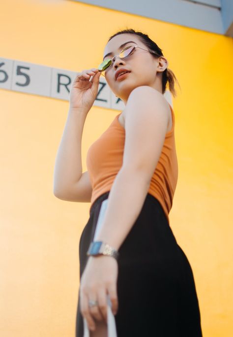 Woman In Sunglasses, Foto Editorial, Perspective Photos, Photo Of Woman, Wearing Purple, Perspective Photography, Purple Sunglasses, Female Pose Reference, Yellow Wall