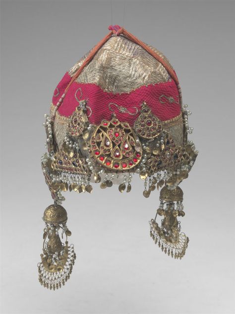 A fabulous Kashmiri hat with many silver and glass ornaments.  AMNH Kashmiri Jewellery Vintage, Kashmiri Jewellery, Kashmiri Culture, Vintage Kashmir, Mughal Jewelry, Vintage Indian Jewelry, Kundan Jewellery Bridal, Artificial Snow, American Museum Of Natural History