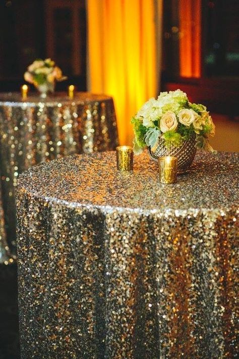 Sit-down dinner or no, a sequin tablecloth adds instant glittering drama to a dining table, refreshments table, or even a small cart in the corner. Gold Tablecloth, 1920s Party, Nye Wedding, Sequin Tablecloth, Great Gatsby Party, Nye Party, Gatsby Party, Gatsby Wedding, Wedding Winter