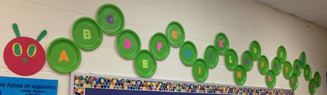 Each preschooler picks a plate and then verbally identifies the letter they chose (letters of the alphabet are glued onto dollar tree green plates). We work together to put our Hungry Caterpillar in alphabetical order. It is then proudly displayed above our bulletin board. Eric Carle Classroom Theme, Hungry Caterpillar Classroom, Eric Carle Classroom, Opening A Daycare, Birthday Board Classroom, Board Classroom, Preschool Rooms, Preschool Bulletin, Preschool Classroom Decor