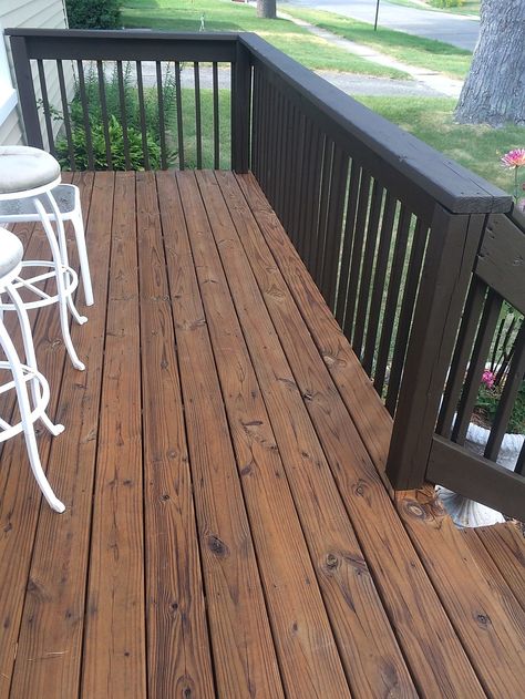 Dark Porch Stain, Dark Stained Deck With Black Railings, Dark Porch Ideas, Black Wood Deck Railing, Brown Deck With Black Railings, Brown And Black Deck Ideas, Deck Colors Ideas Paint Brick House, Brown House Deck Color, Stained Back Deck